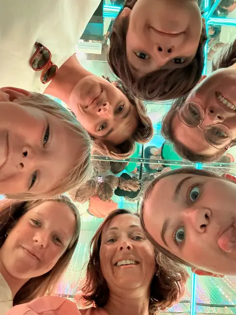 Friends taking photos together inside Fantasy Museum Palma